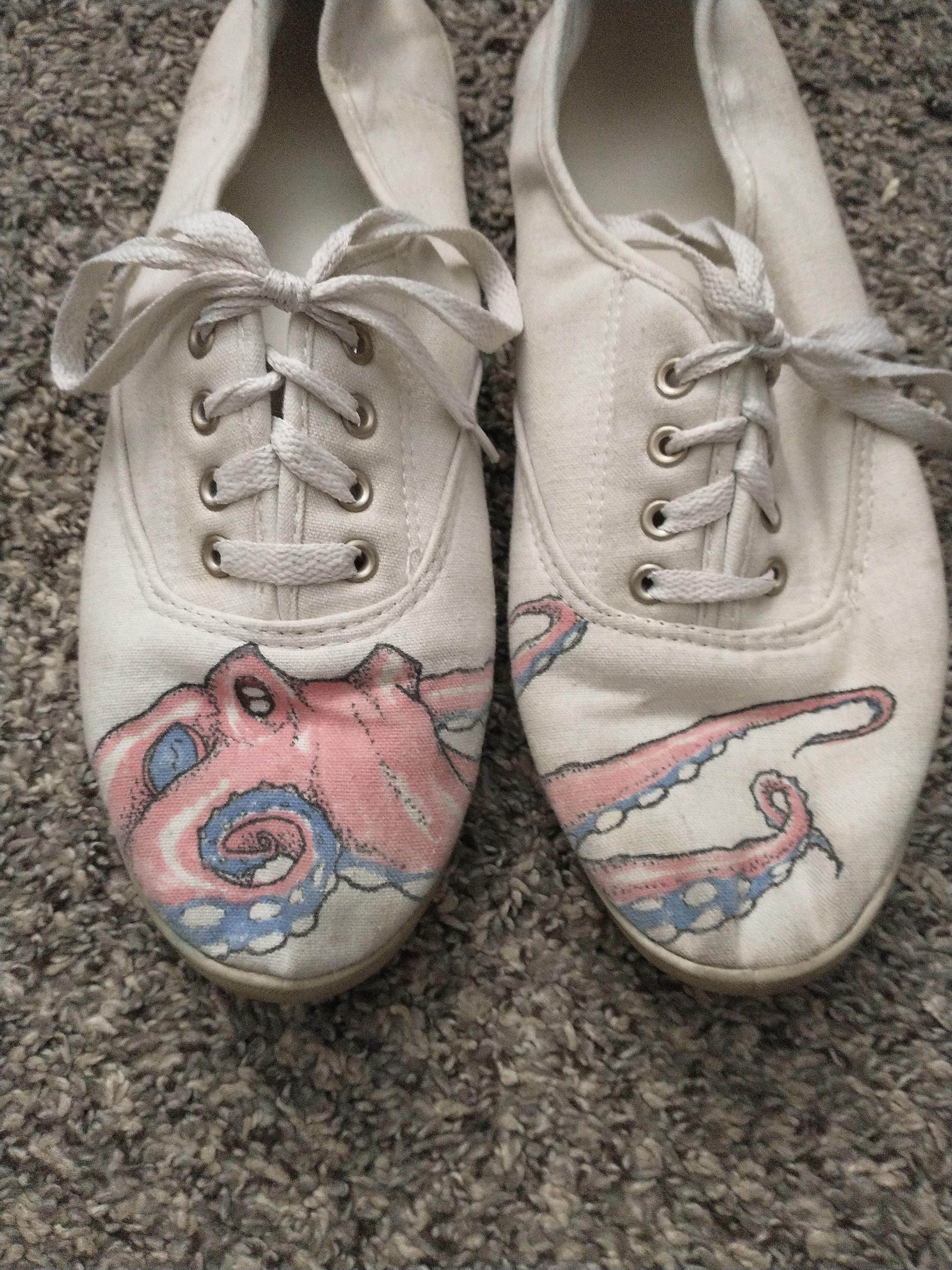 an octopus drawn on canvas shoes